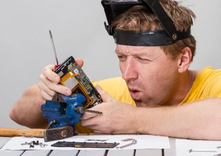 A man wearing a visor while working on a project