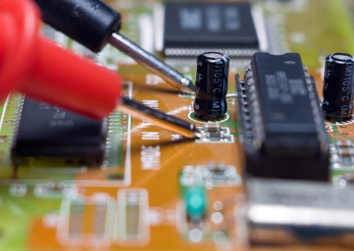 A close up of a circuit board with numerous electronic components