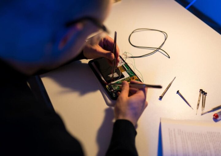 A man is writing on a piece of paper